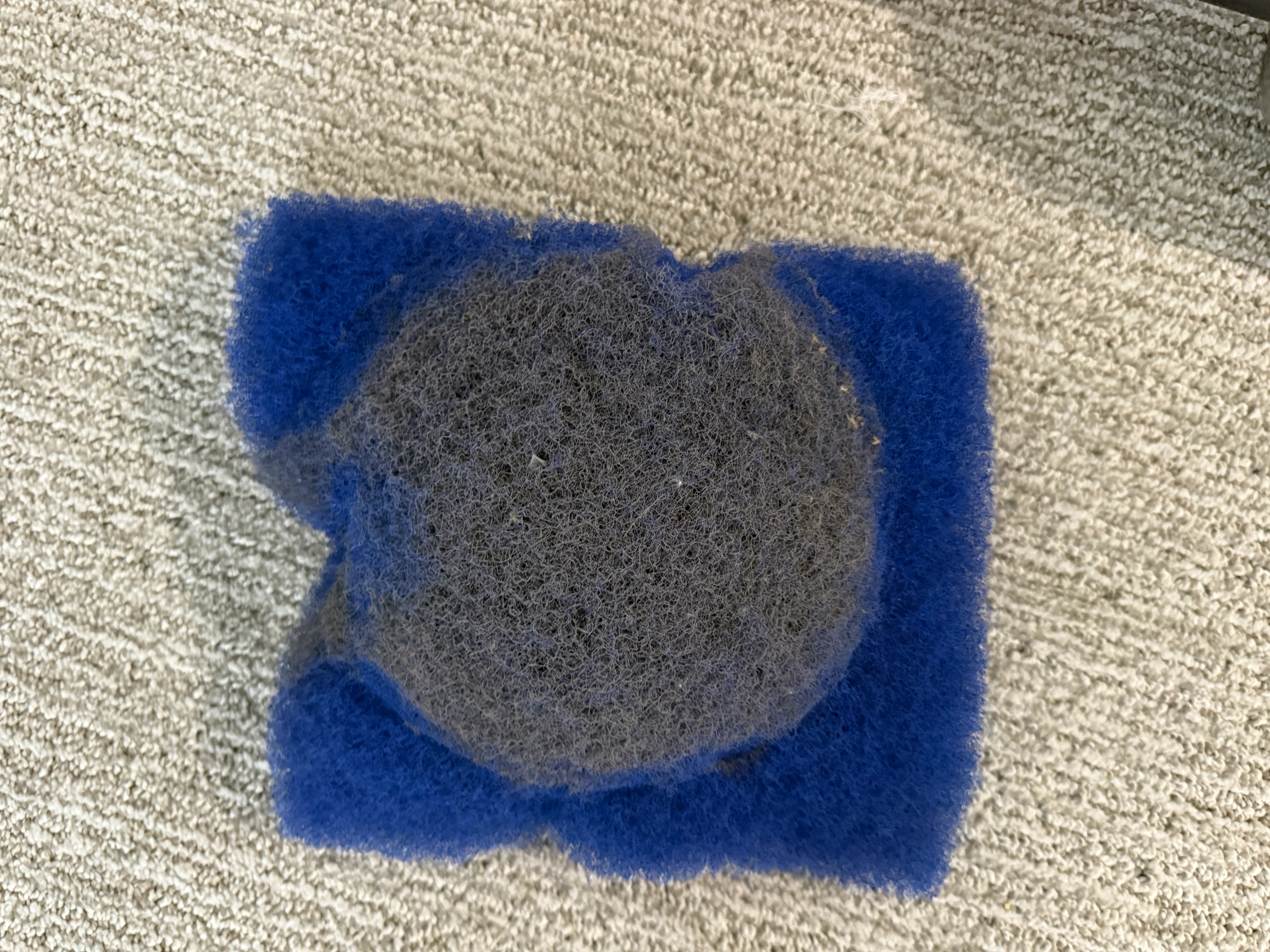 darker-blue MERV-1 pad
